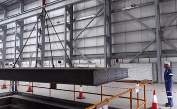 A Jacobs employee inspecting a suspended component in the Beckermet Engineering and Technology Centre.